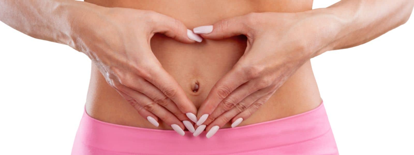 An image of a female abdomen with hands over it in the shape of a heart to represent a happy digestive system after colonic irrigation