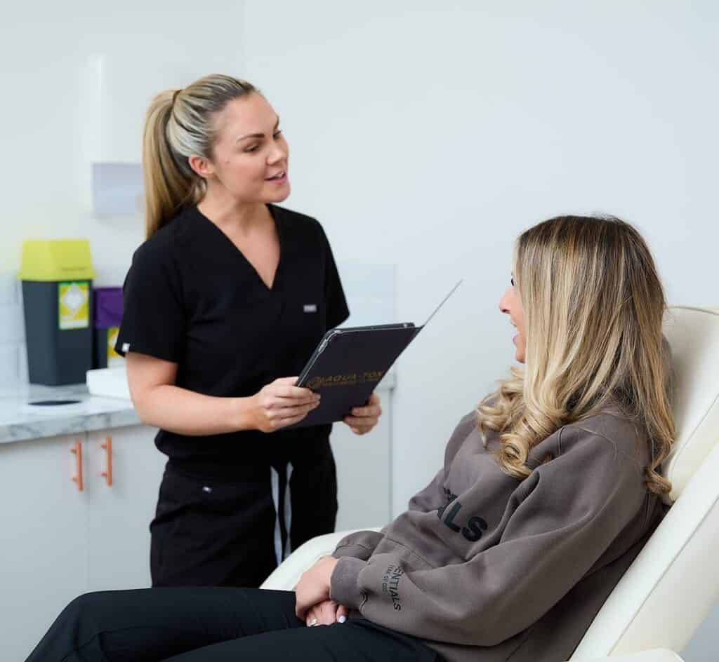a female aesthetics nurse consults with a female client